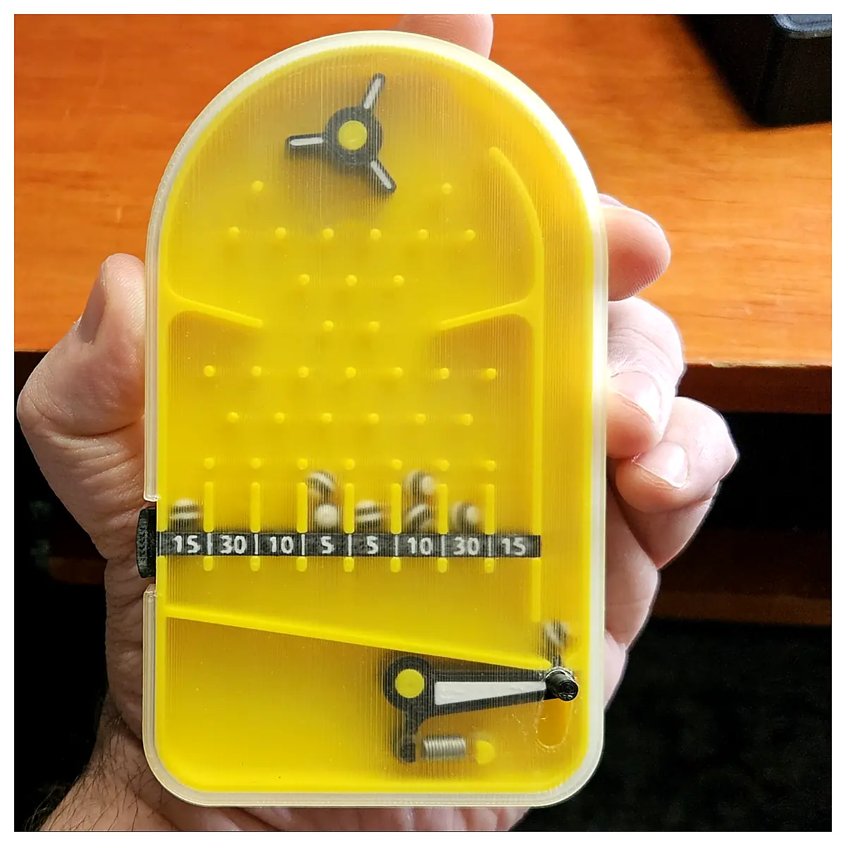 Pinball Toys Close Relatives of Handheld Pinball Machines Pinball Parts Replacement Balls Repair Services