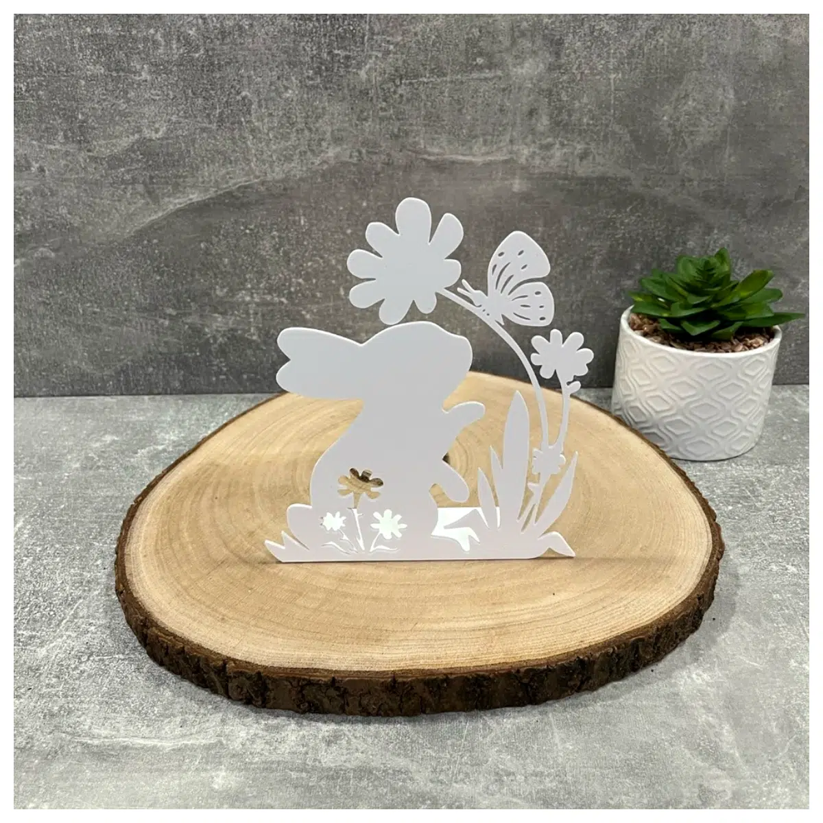 easter bunny figurine with flowers and butterflies on spring home decor holiday table centerpiece