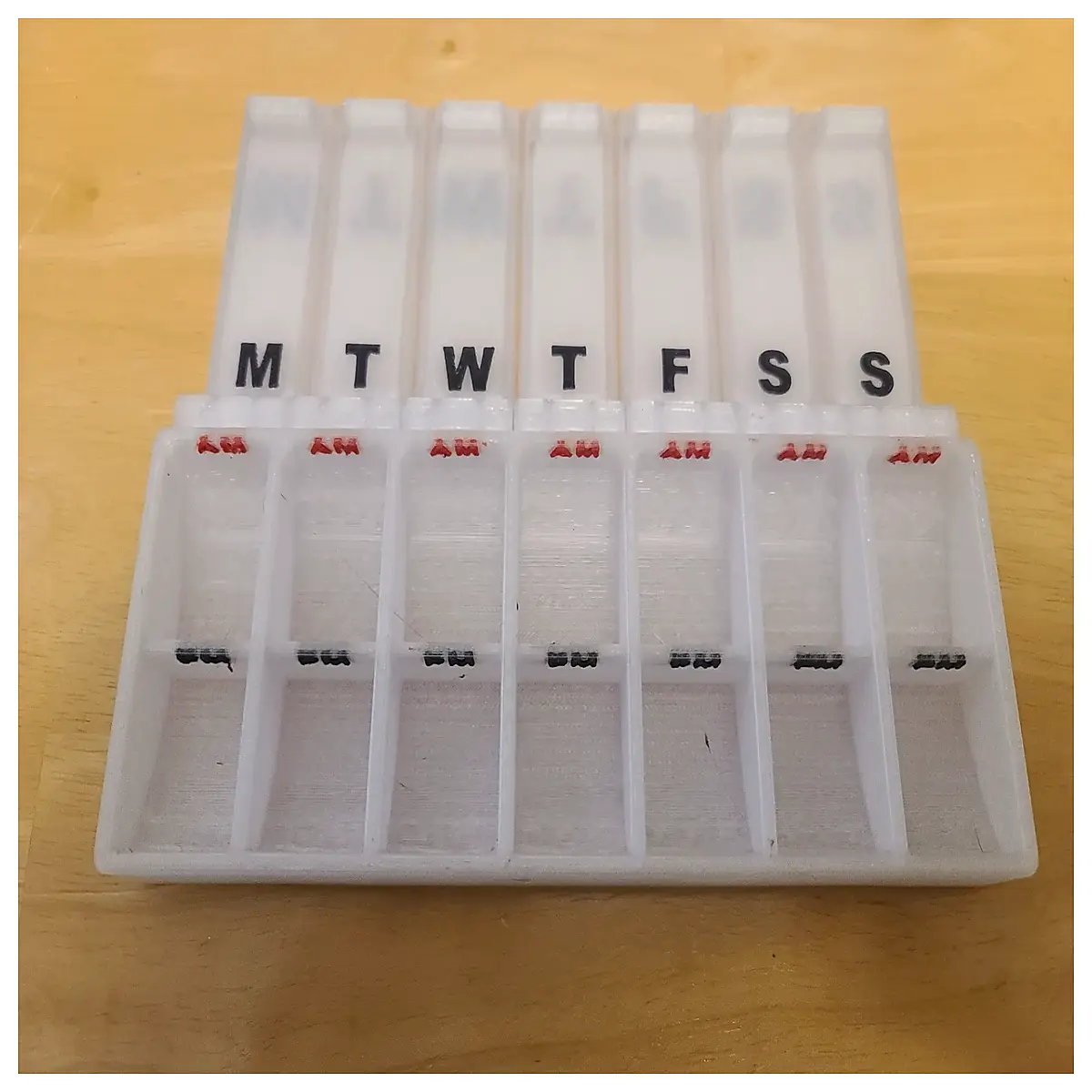 weekly pill organizer with am pm compartments portable medicine box for daily health management and travel