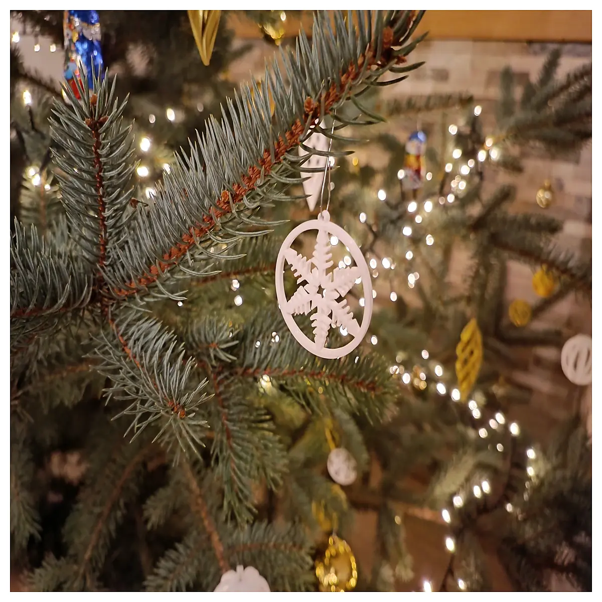 snowflake bell ornament in circle frame winter holiday decor festive window hanging cozy seasonal accent piece