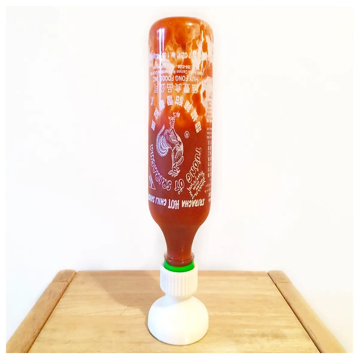 inverted sriracha sauce bottle holder for fridge door organization spicy chili condiment dispenser rack