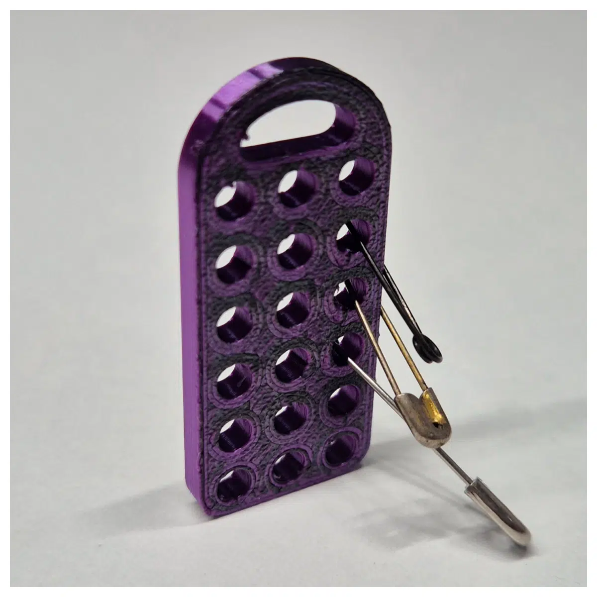 stainless steel safety pin storage case with keychain clip for travel organization and emergency repair