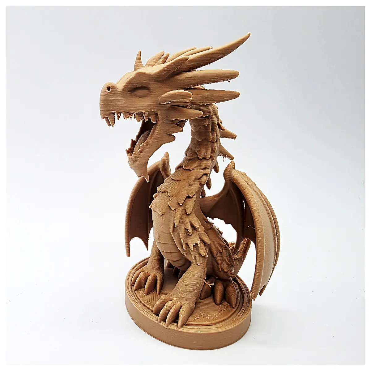 cute dragon figurine with open mouth standing on base for desk decoration