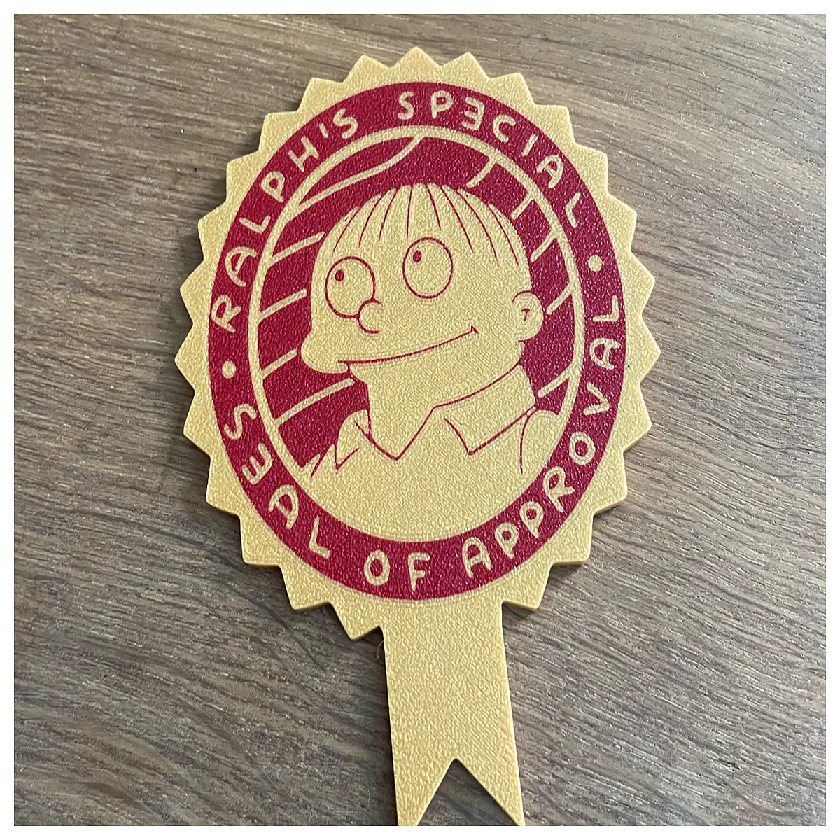 Ralph Wiegum Bicolor Commemorative Seal Award Collectible Historical Seal Auction Piece