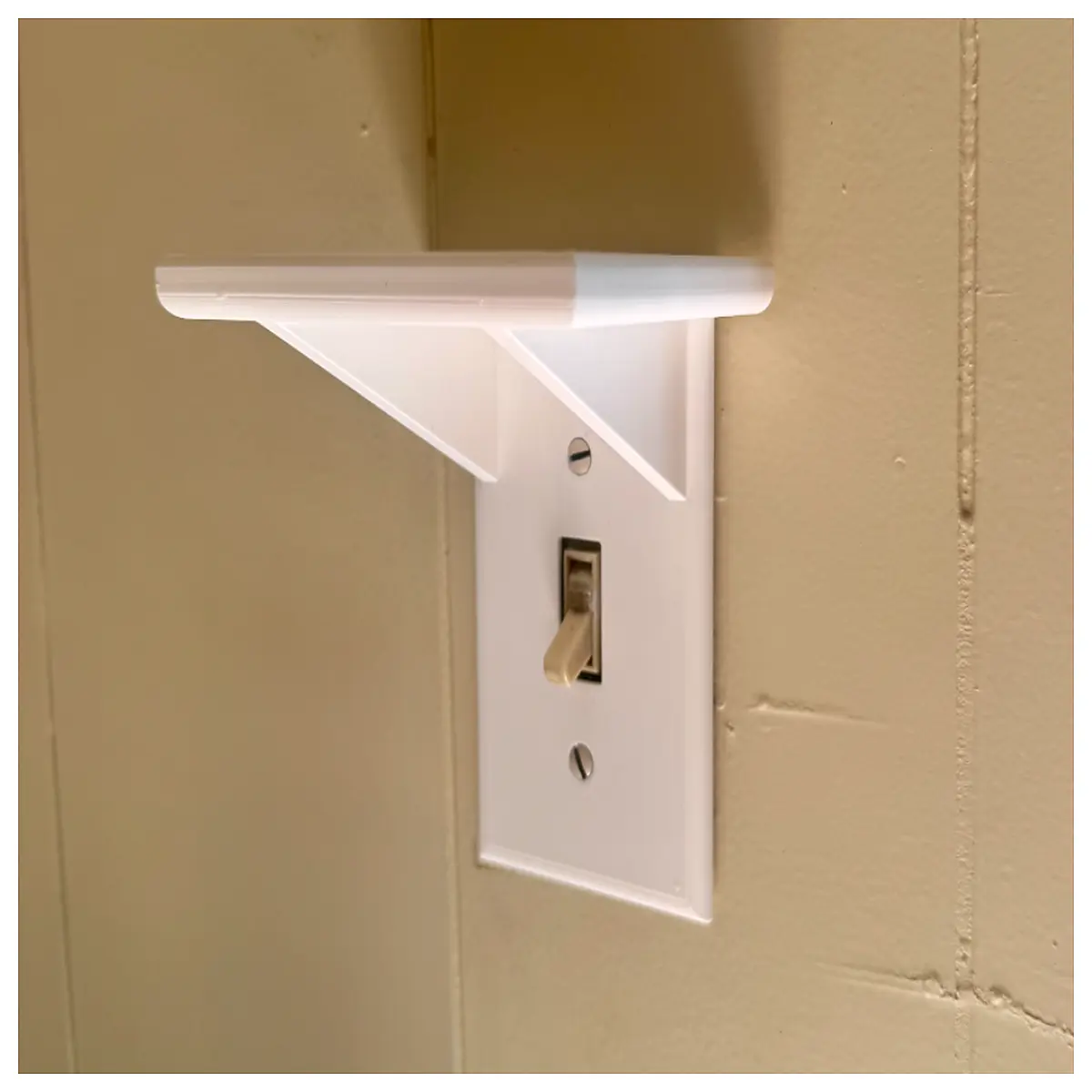switch with built in shelf organizer for remote storage wall plate holder