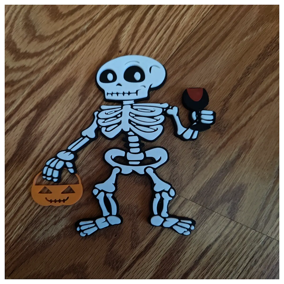 halloween skeleton prop holding trick or treat basket with wine bottle for party decor