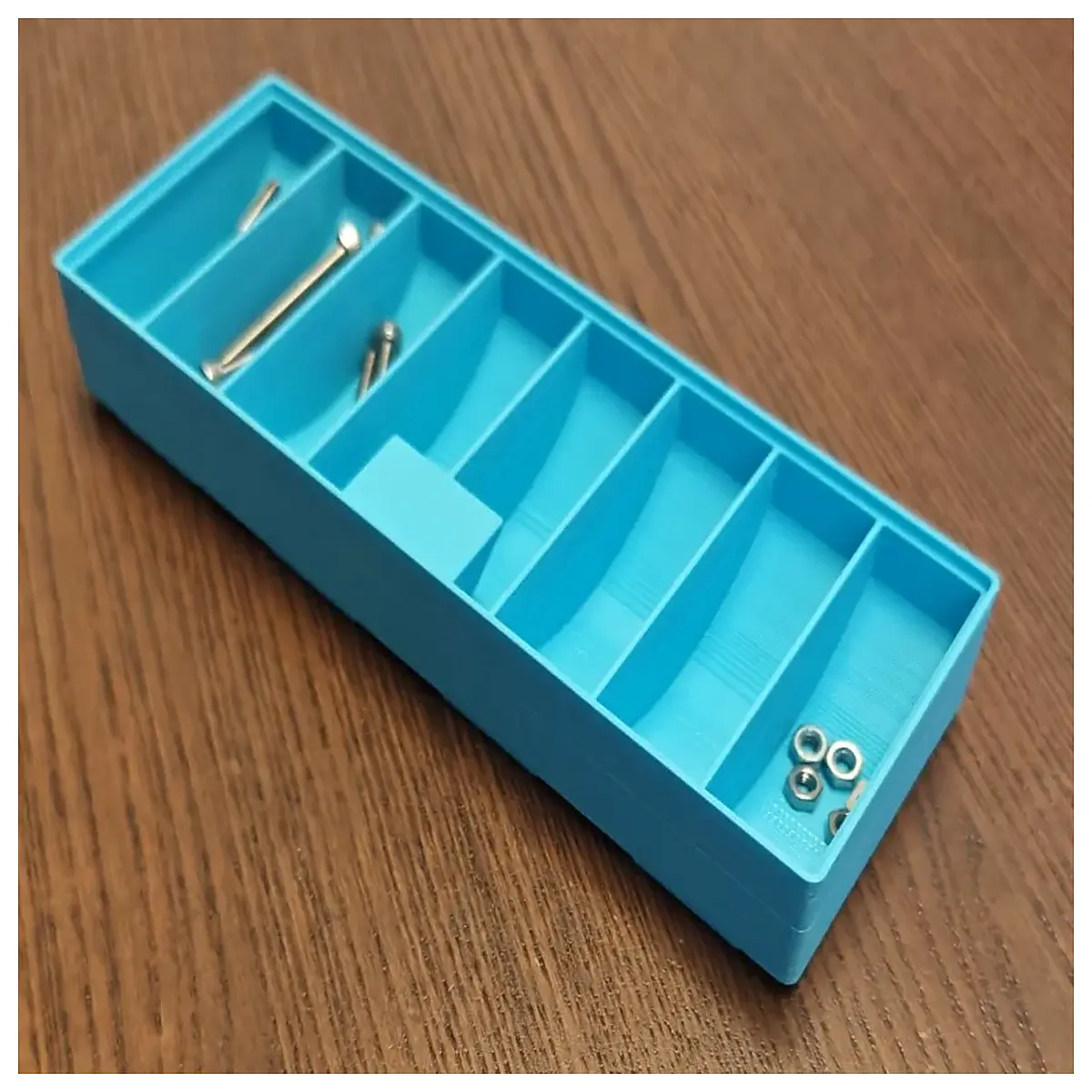 portable storage box with dividers for organizing tools and parts