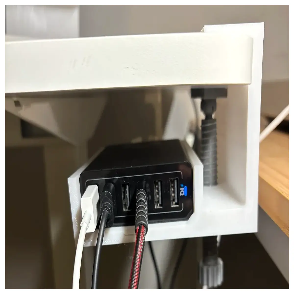 desk mount charging station for multiple devices with usb ports and cable management organizer