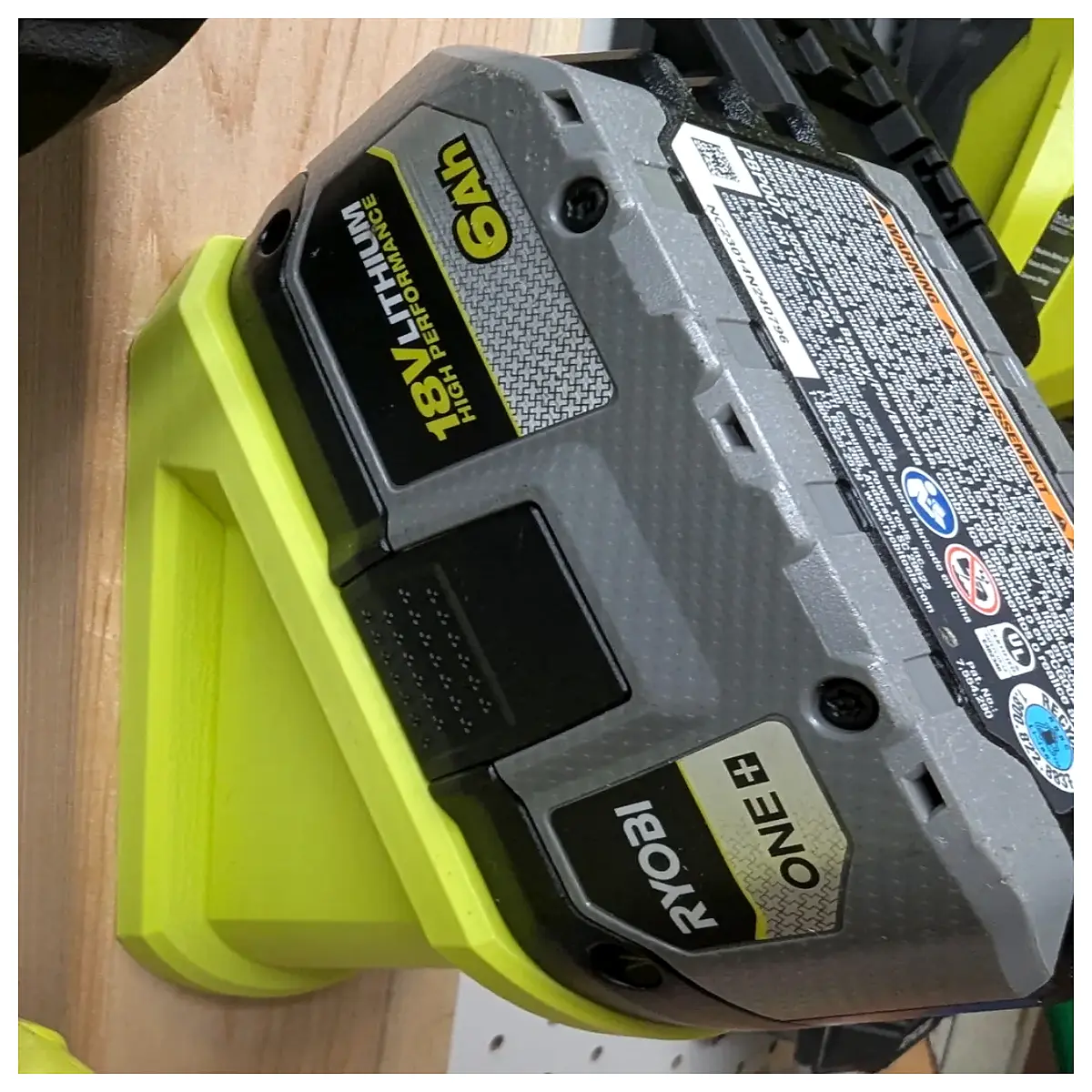 ryobi 18v battery holder mount bracket with screw holes for tool storage organization