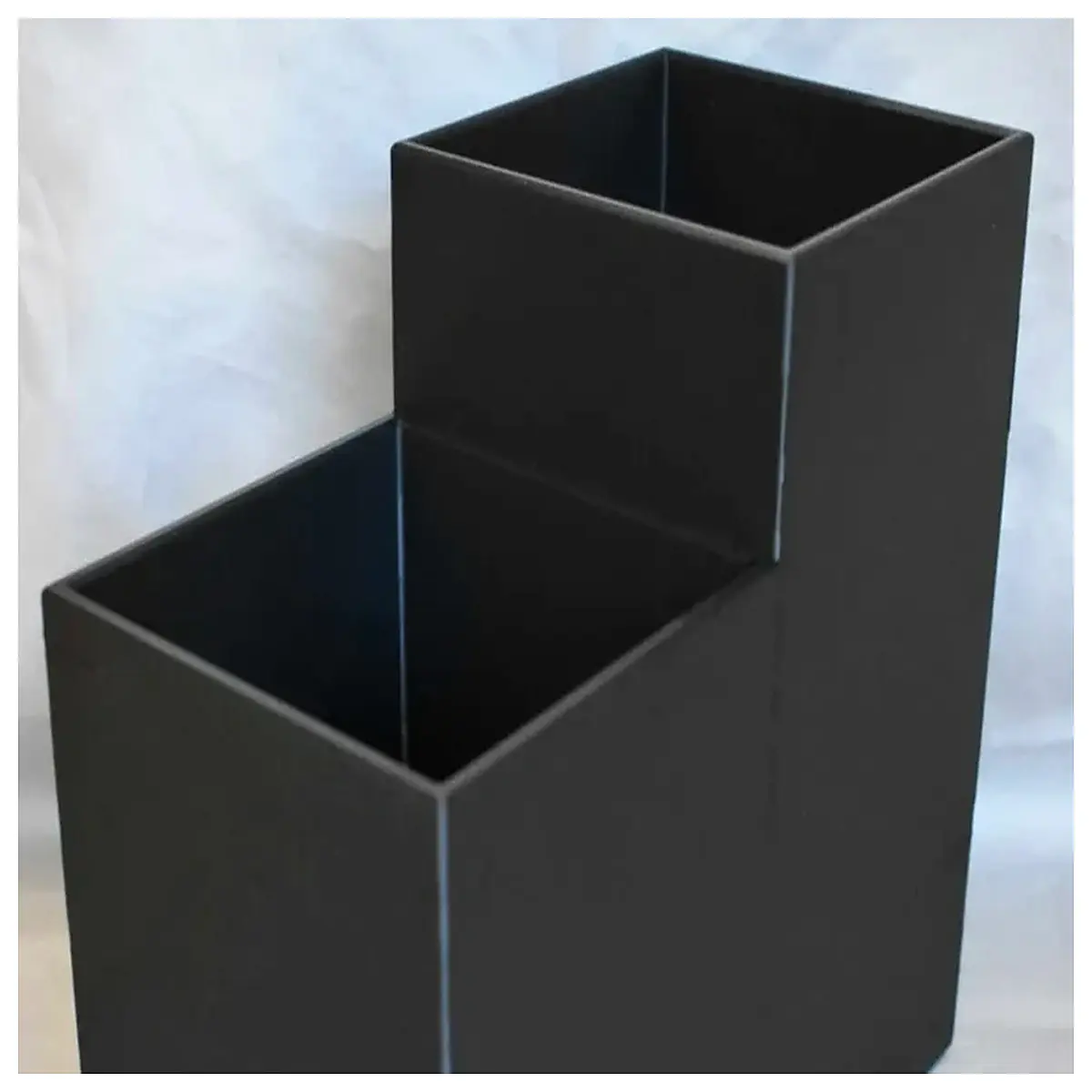 elevated straw holder organizer with raised back for countertop storage