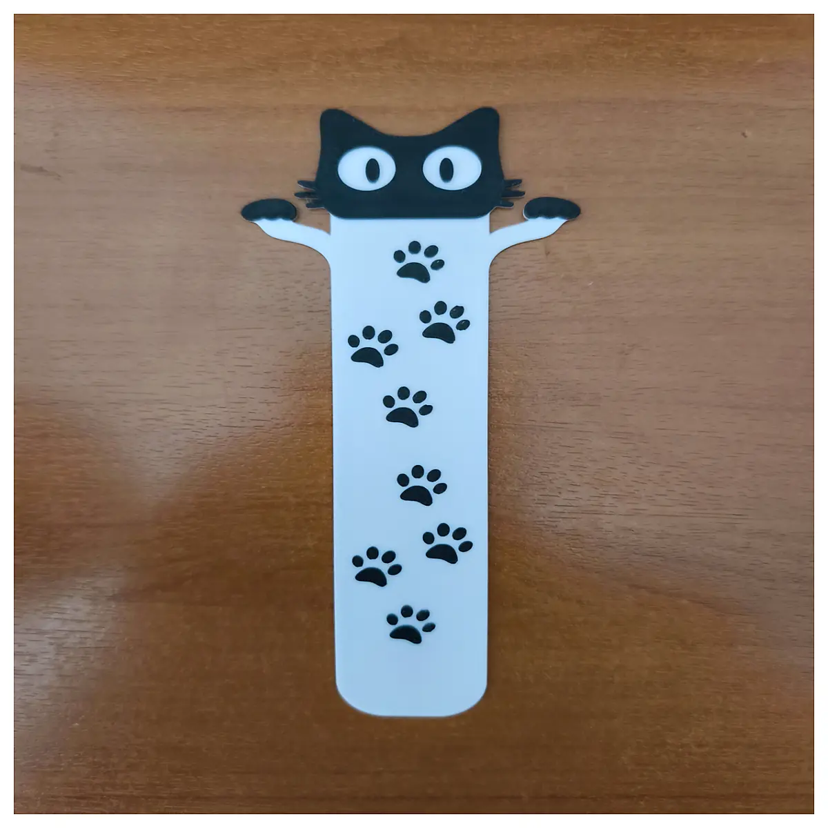 cute cat bookmark with long tassel and paw print design for reading lovers