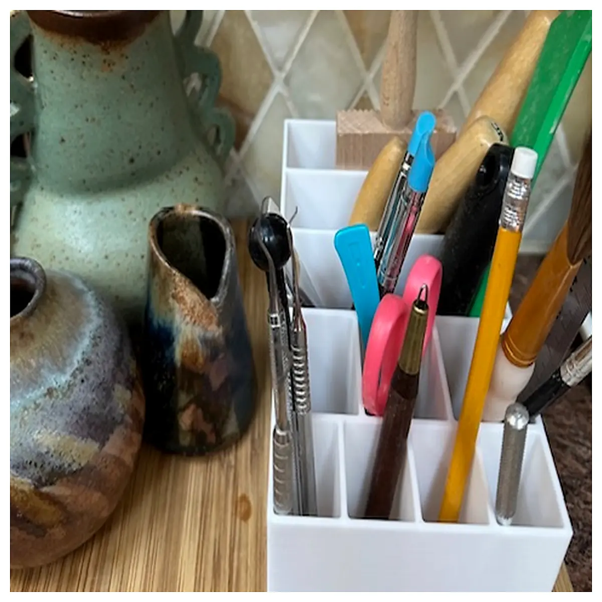 ceramic pottery tool organizer with drainage holes for studio storage