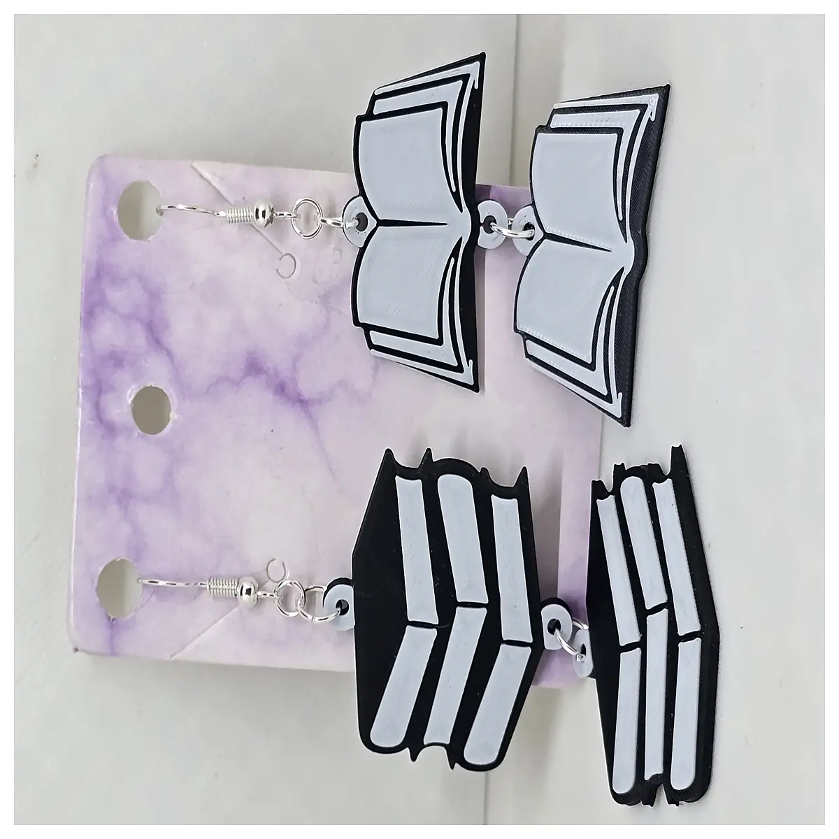 book shaped earring holder with single or double hole for organizing studs and dangles on desk