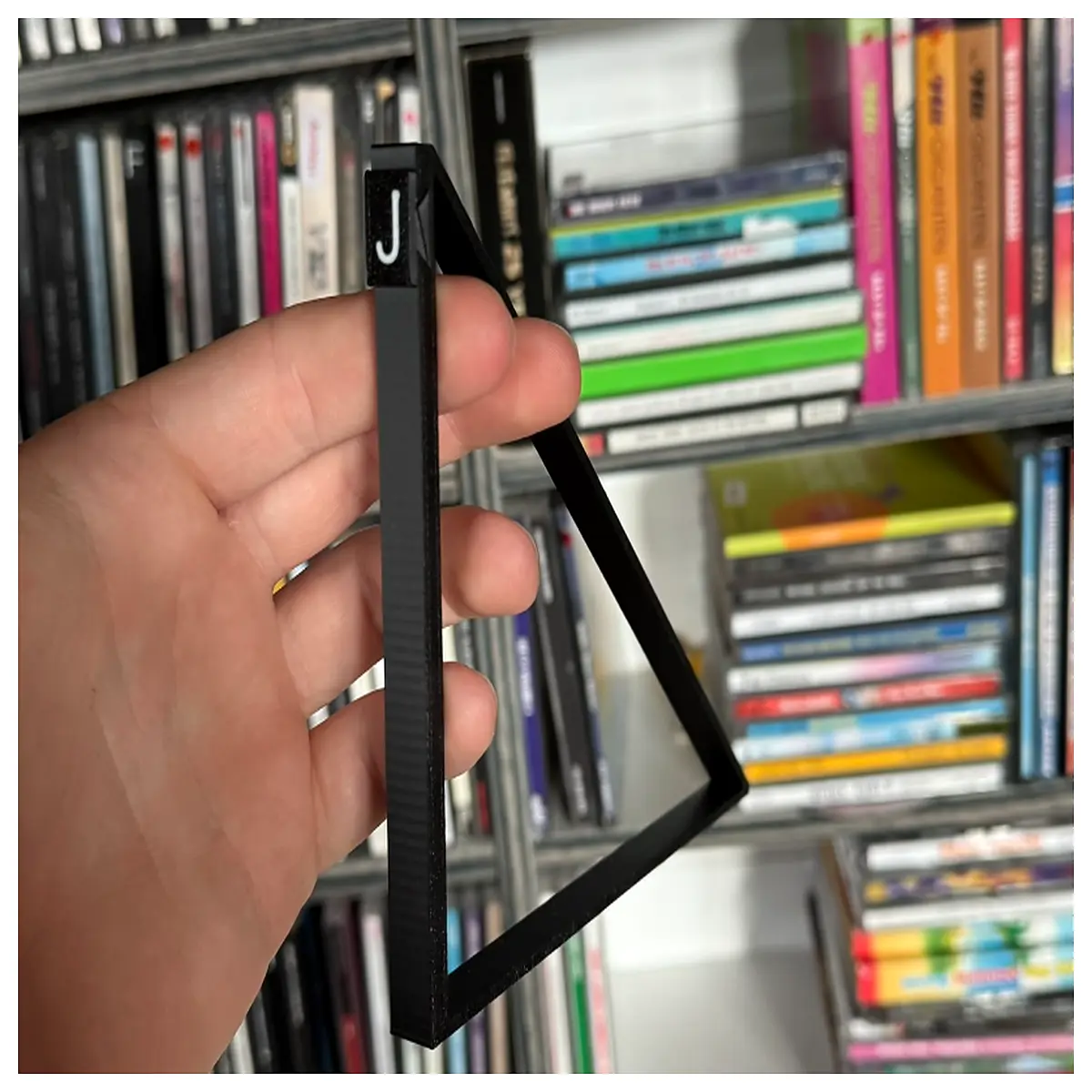 vinyl record storage rack with alphabet letter labels for sorting music collection organization