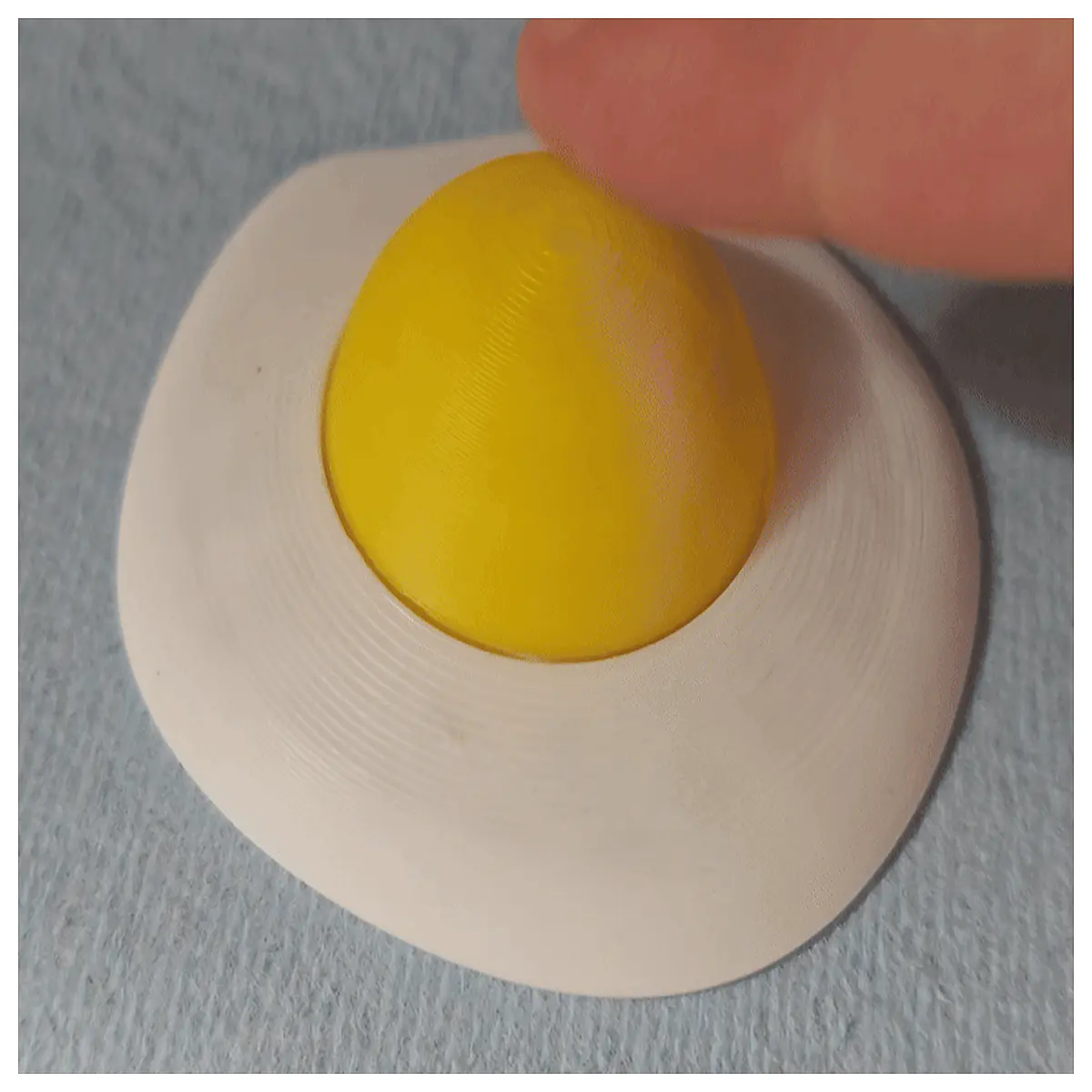 sunny side up egg shaped clicker fidget toy for stress relief anxiety calming sensory tool