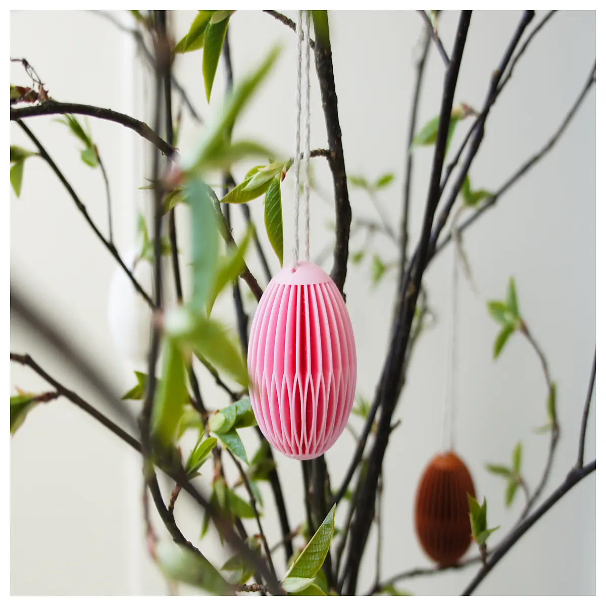 spring lace egg shaped dessert delicate floral pastry for easter brunch elegant tea time treat with intricate lace pattern design
