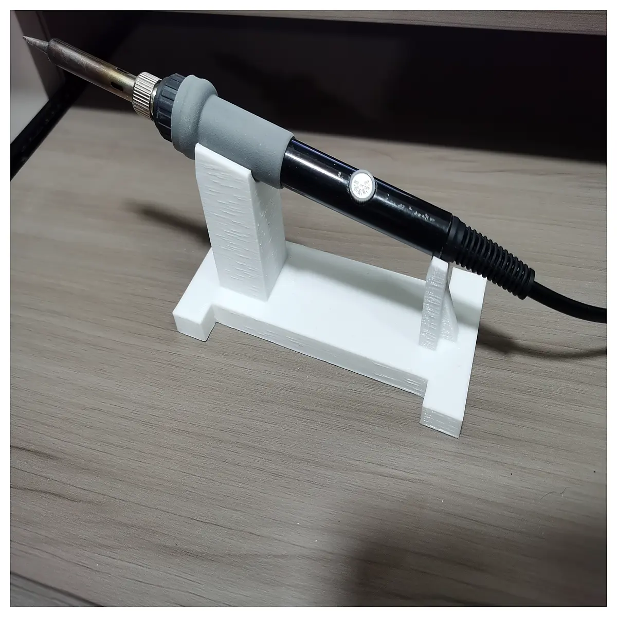 soldering iron holder with sponge and brass wire tip cleaner for electronics repair workbench