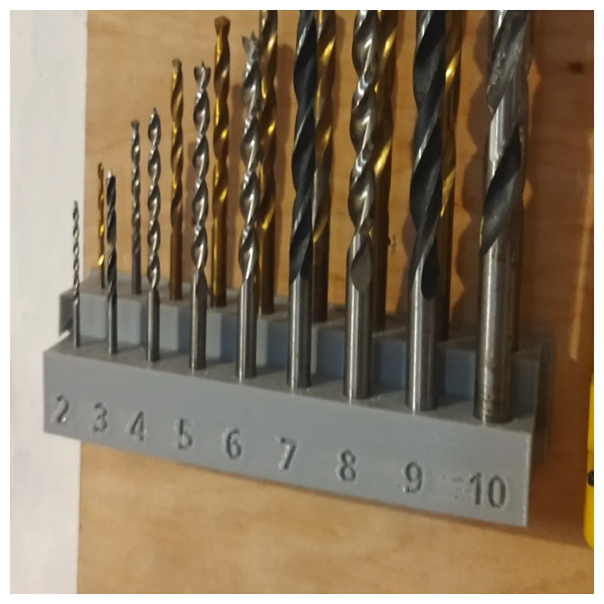 rotating drill bit wall mount organizer rack storage holder for garage workshop tools