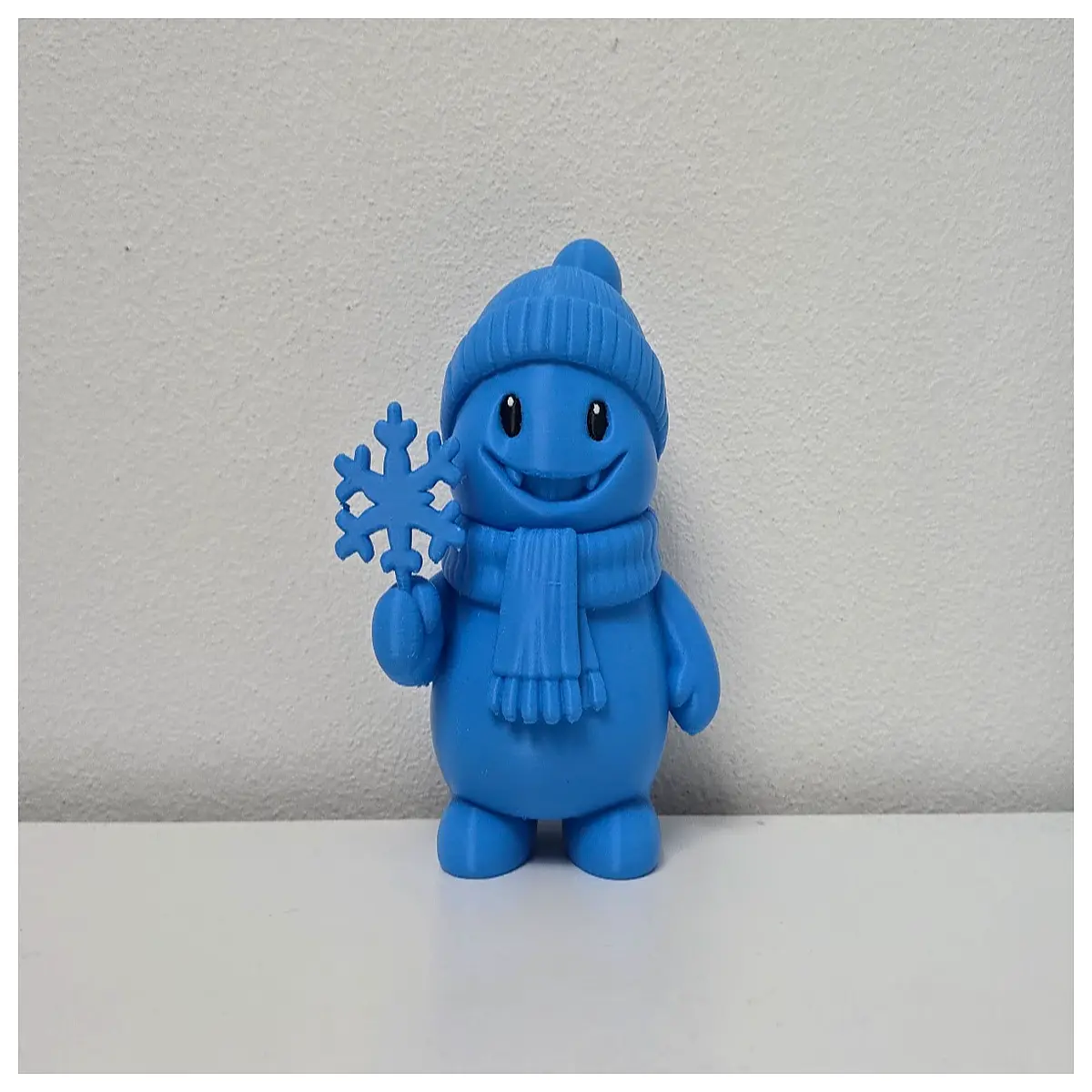 cute holding snowflake smiley snowman figurine holiday table decor christmas ornament