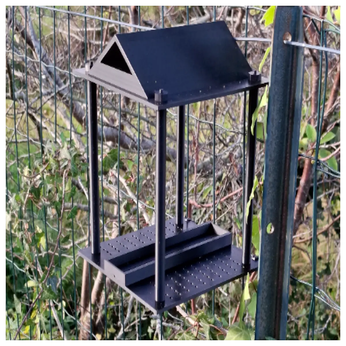 outdoor bird feeder station with seed hopper and perches for backyard wildlife
