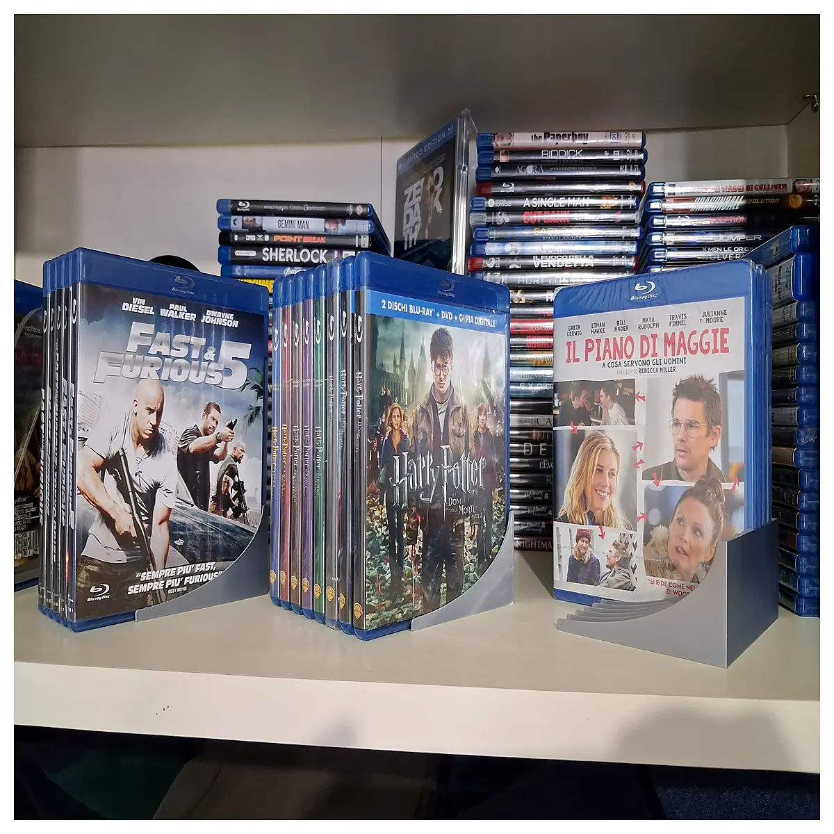 blu ray disc storage box with labeled dividers for movie collection organization