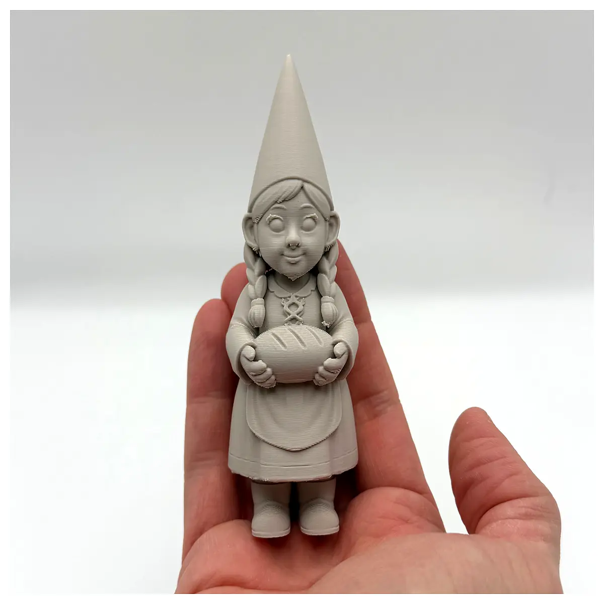 cute miniature gnome figurine holding bread loaf kitchen decor