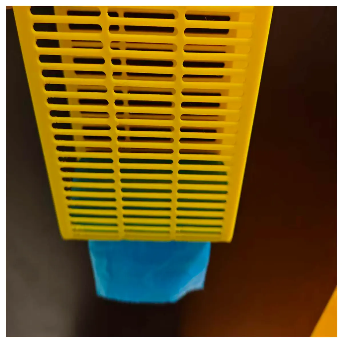 trash can liner roll holder organizer with cutout dispensing hole for kitchen bin storage
