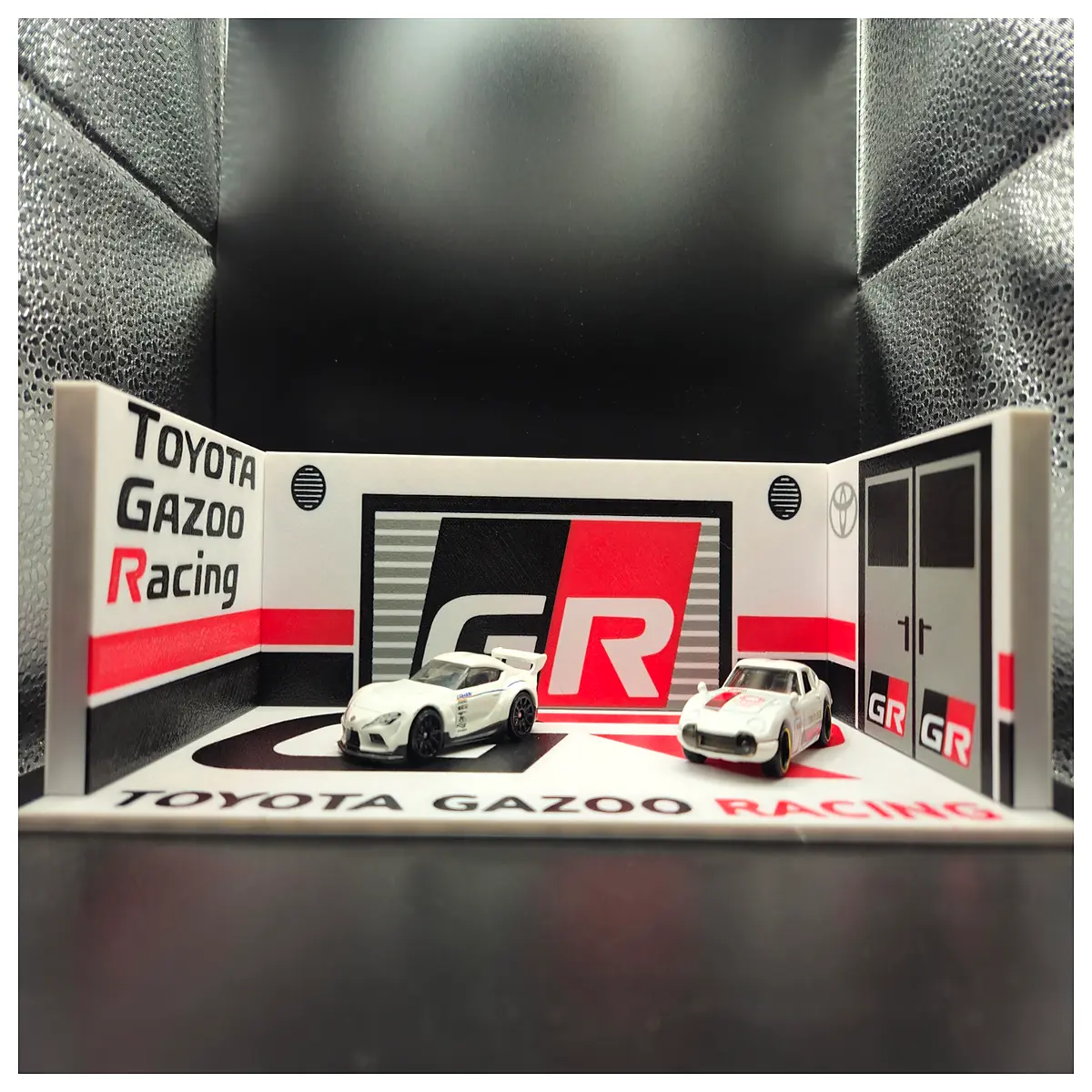 detailed miniature garage diorama with realistic tools and car parts for hobbyists