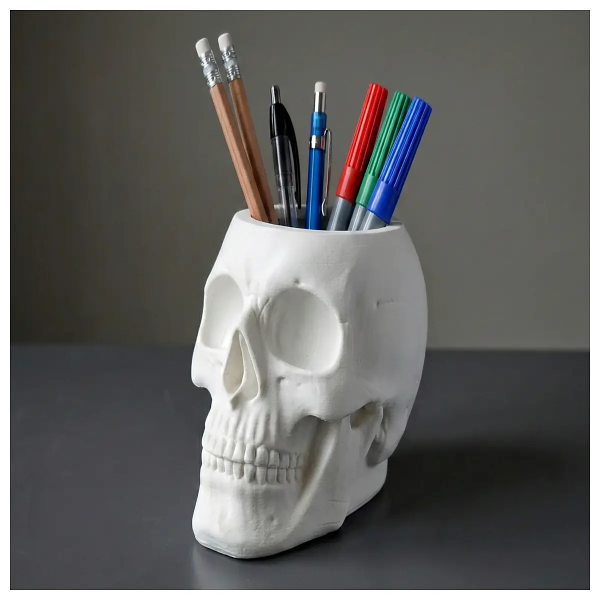 skull pen holder desk organizer macabre gothic stationery container spooky office decor writing utensil storage